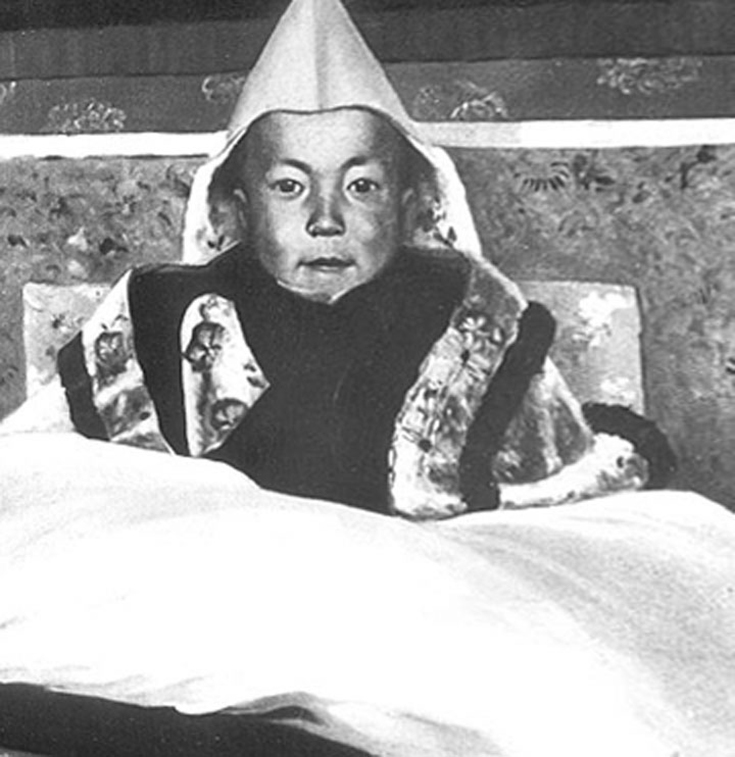The 14th Dalai Lama as a young boy. Image via public domain.