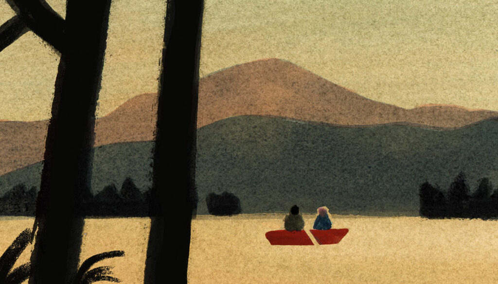 Boat crossing the water, mountains in the background.