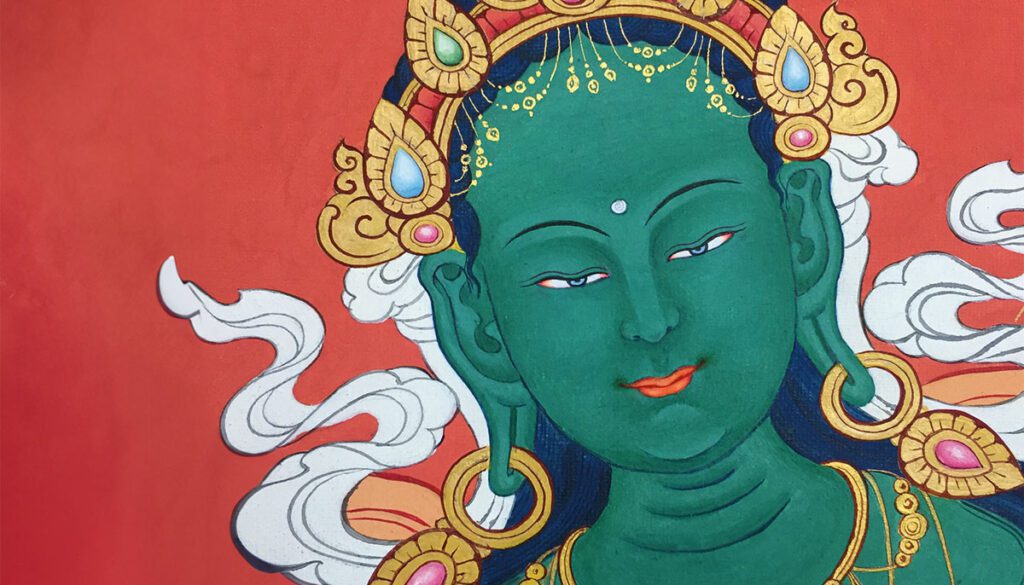 Thangka detail of green tara, against red background.