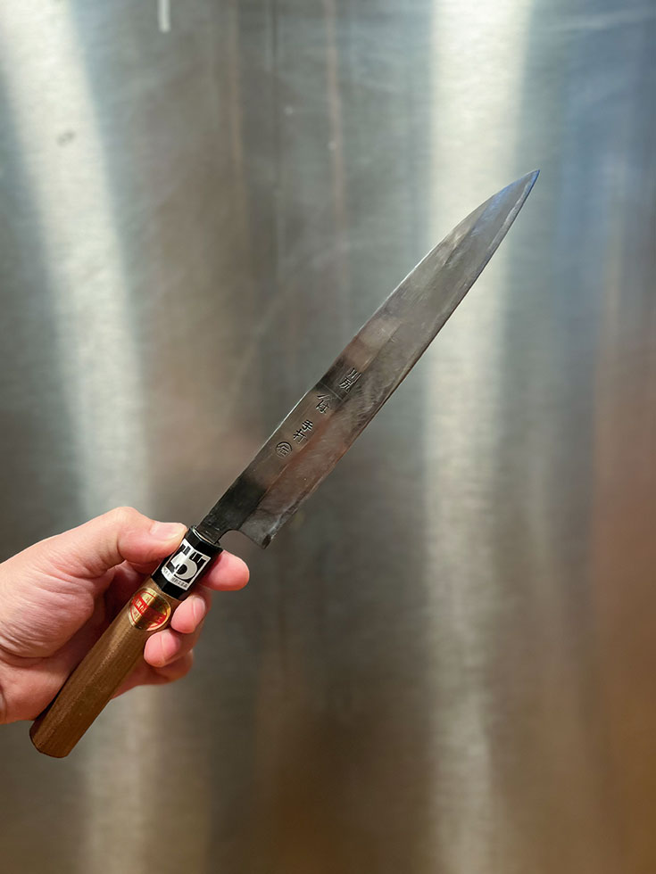 Karla Palma holding his chef knife