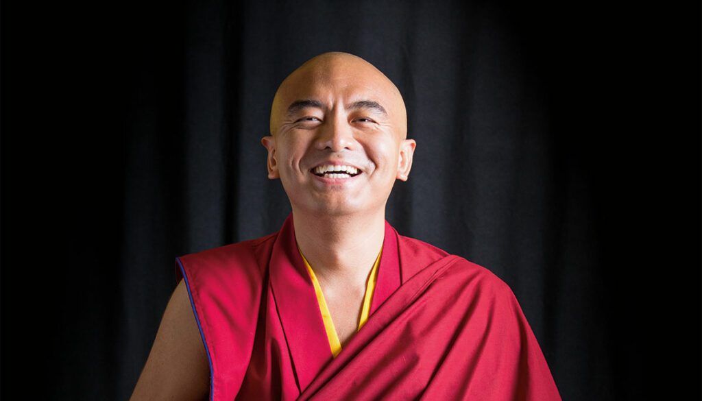 Mingyur Rinpoche smiling at camera.