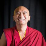 Mingyur Rinpoche smiling at camera.