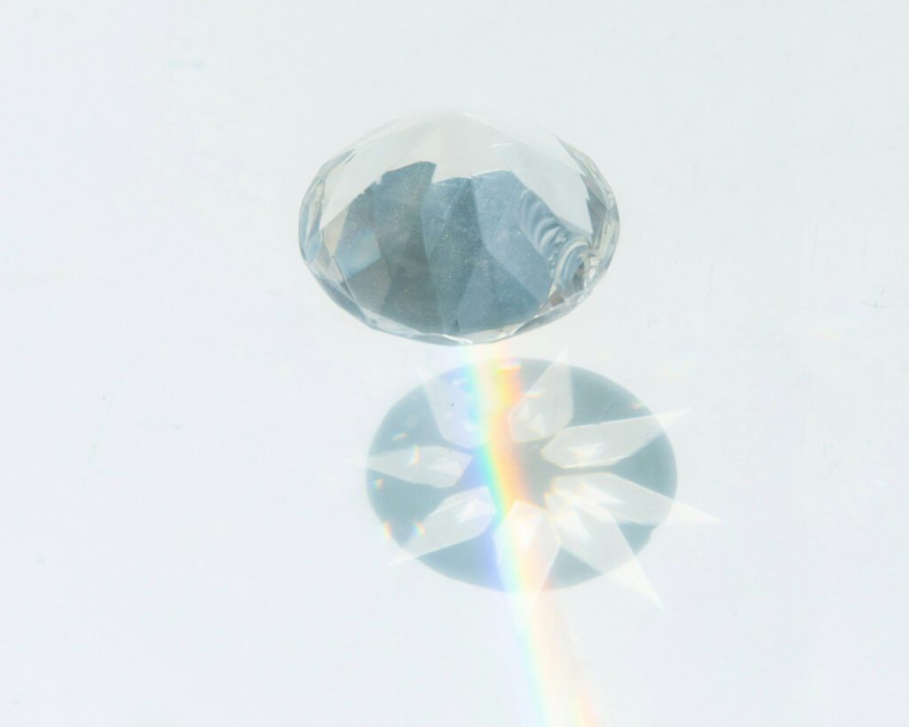 A diamond is seen refracting colored light.