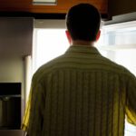 Man looking into fridge