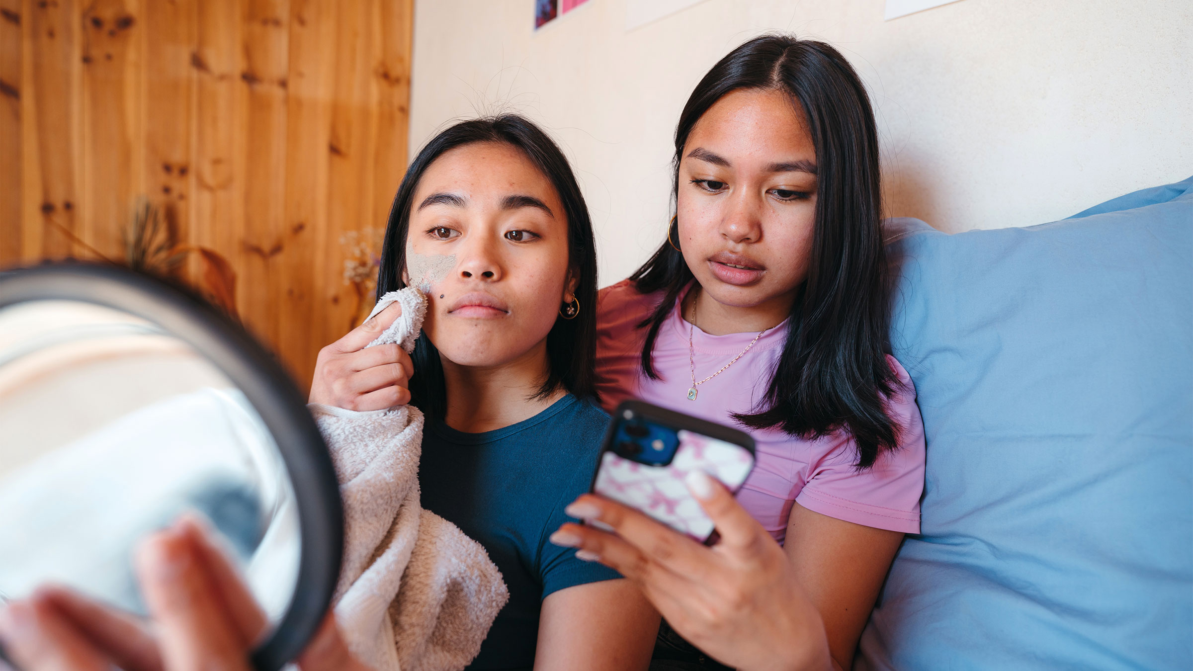 Photo of two teenage girls being teenages, for "Best Practices for Raising Teens" by Nuanprang Snitbhan