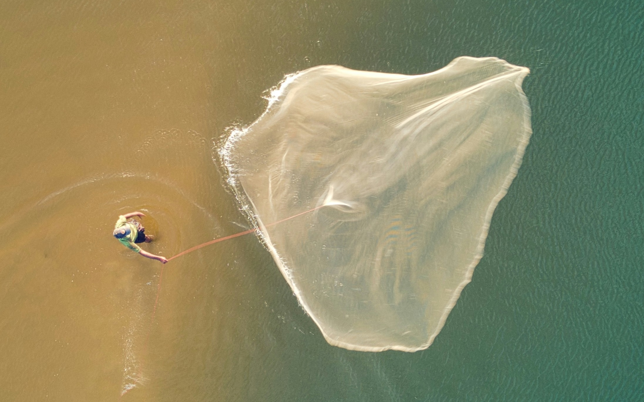 Man Throwing A Fishing Net, Tangalle, Sri Lanka